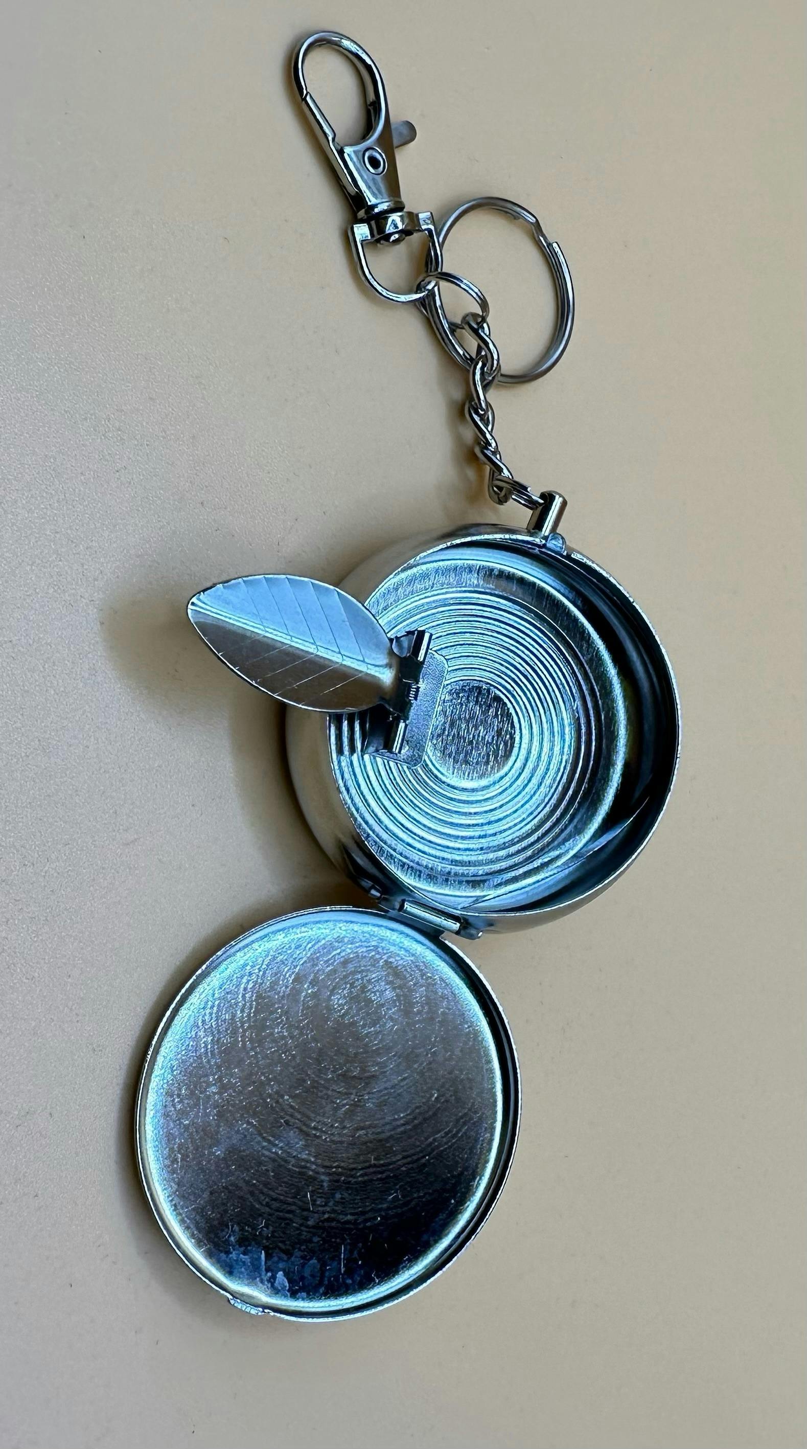 T, Portable Ashtray key chain - styles and colors may vary