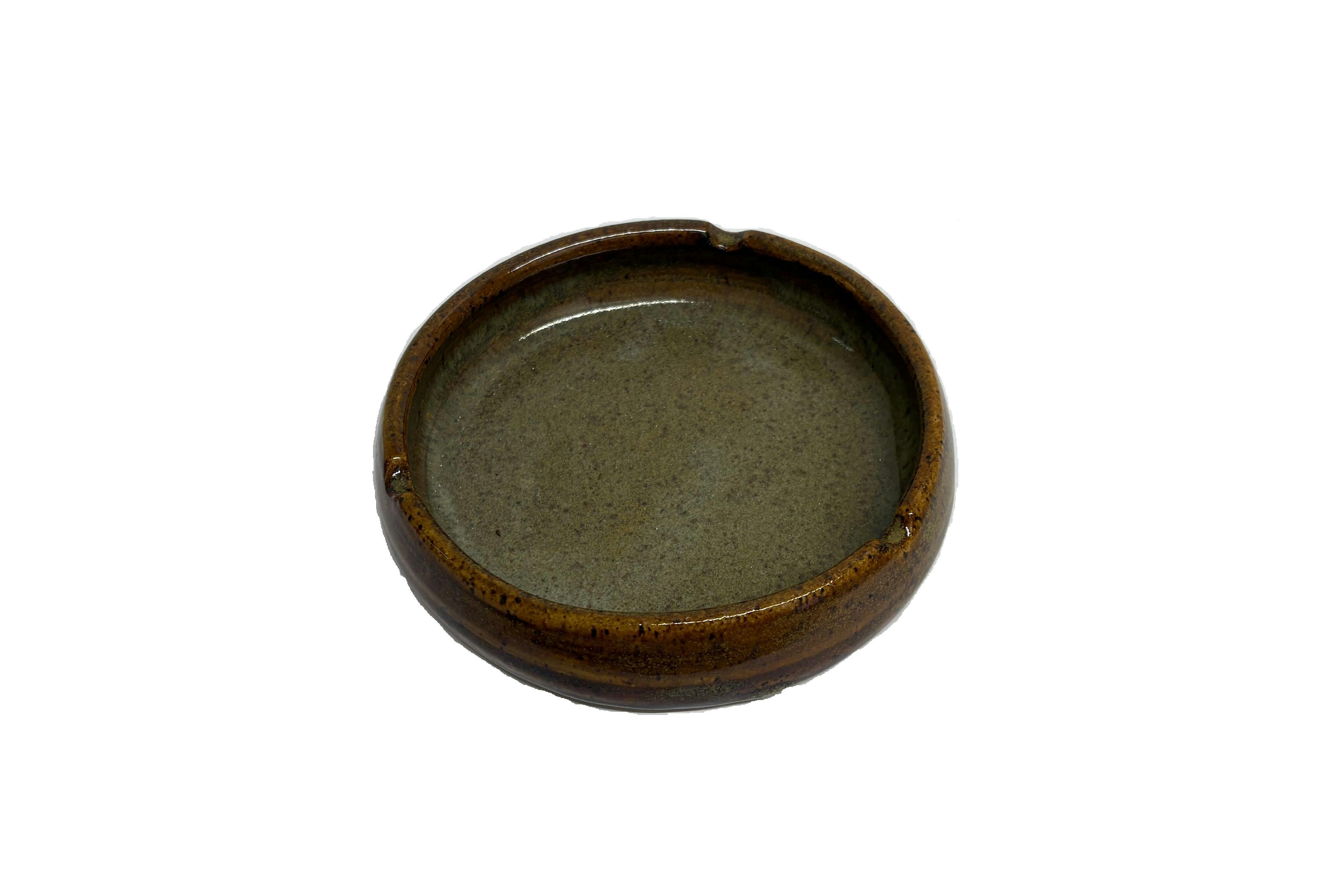 Brown flat clay ashtray